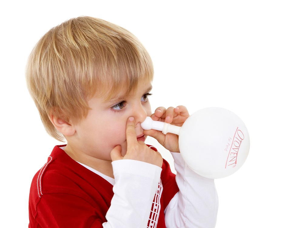 Young boy demonstrates the nasal balloon